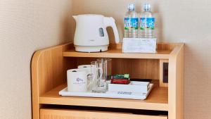 a shelf with a blender and other items on it at Hotel Monte Hermana Tokyo in Tokyo