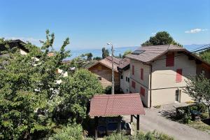 a house with a garage and a house at Apt type 3 en Duplex sur EVIAN les Bains vue lac in Évian-les-Bains