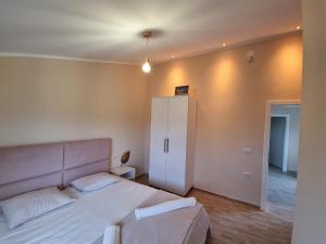 מיטה או מיטות בחדר ב-Ballkan B&B 1