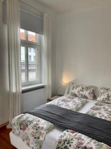 Postel nebo postele na pokoji v ubytování Kläve12 Guesthouse