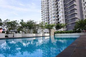 a large swimming pool in front of a building at HOT! Niki Adina - City Centre - Astro - MSU - WiFi in Shah Alam