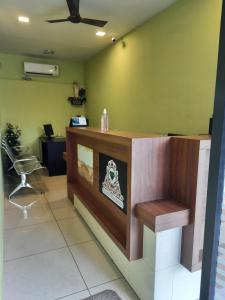 a bar in a room with a hair salon at Emerald Royal Residency in Cochin