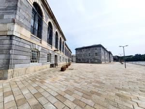 an empty courtyard of an old building at Royal William Yard - Lovely 1-Bed Apartment in Historic Plymouth in Plymouth