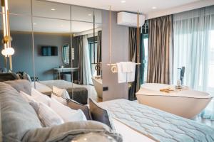 Postel nebo postele na pokoji v ubytování Apartments Eneida + 37 fotografií