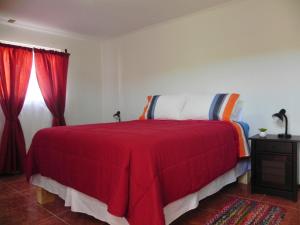 Cama o camas de una habitación en Hostal Siete Colores