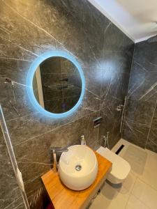 a bathroom with a sink and a mirror at Villa Denis Ksamil in Ksamil