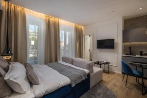 Posteľ alebo postele v izbe v ubytovaní Bella Vita Apartments
