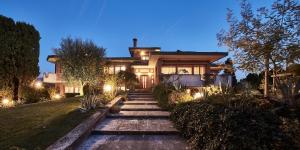 a house with a pathway leading to it at night at La Dimora Del Bassotto in San Giuliano Terme