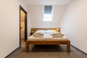 Postel nebo postele na pokoji v ubytování Penzion na Vinařství
