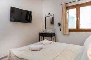 Posteľ alebo postele v izbe v ubytovaní Naxian Asset