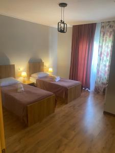 Letto o letti in una camera di Lanchvali Inn