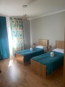 Letto o letti in una camera di Lanchvali Inn