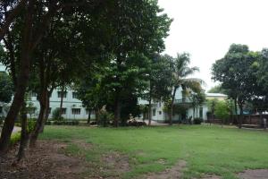 a white house with trees in front of it at Seva Kendra Hijli Kharagpur in Kharagpur