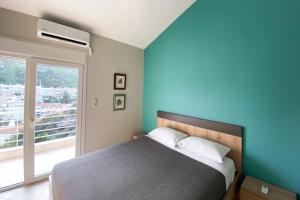 Posteľ alebo postele v izbe v ubytovaní Bellevue Homes