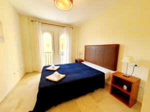 En eller flere senge i et værelse på Atalaya Apartment 2 Bedrooms + 34 billeder