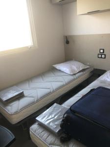 Posteľ alebo postele v izbe v ubytovaní Camping le Castellas