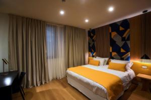 Un pat sau paturi într-o cameră la Magnolia Napoli