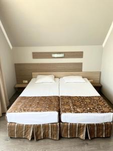 two beds in a room with two beds sidx sidx sidx at Villa Orange in Sozopol