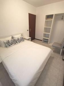 Ένα ή περισσότερα κρεβάτια σε δωμάτιο στο Rosolina (Paese) Apartment