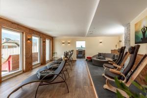 a living room with chairs and a couch at Hotel Die Metzgerstubn in Sankt Michael im Lungau