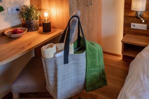 a tote bag hanging on a wall in a room at Hotel Die Metzgerstubn in Sankt Michael im Lungau
