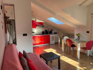 a living room with a couch and a table at Apartments Mery in Rovinj