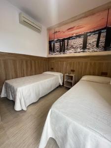 Postel nebo postele na pokoji v ubytování Hostal Noli
