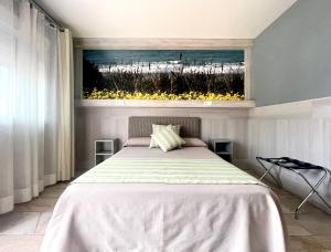 Postel nebo postele na pokoji v ubytování Hostal Noli