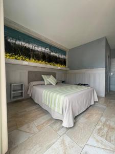 Postel nebo postele na pokoji v ubytování Hostal Noli