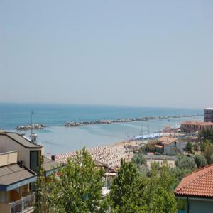 a view of a beach with a crowd of people at Hotel Danubio in San Mauro a Mare