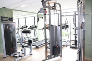 a gym with treadmills and tread machines at The Quart Ruamrudee by UHG - Extra Plus in Bangkok
