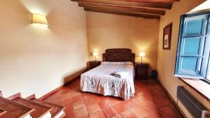 Postel nebo postele na pokoji v ubytování Casa Tinoco Casa Rural Categoria Superior