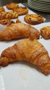 a group of pastries sitting on top of a table at Hotel Due Colonne in San Bonifacio +49 photos