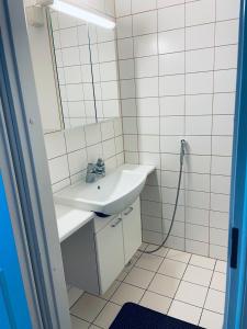 a bathroom with a sink and a mirror at Tallinn Seaside Apartment in Tallinn