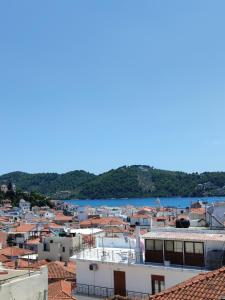 a view of a town with a body of water at VILLA KALDERA in Skiathos Town