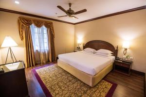 Voodi või voodid majutusasutuse The Carlton Kodaikanal toas