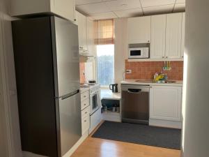 Kuchyň nebo kuchyňský kout v ubytování Tallinn Seaside Apartment