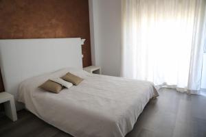 Posteľ alebo postele v izbe v ubytovaní Interno 11 city view with kitchen - 70 mq