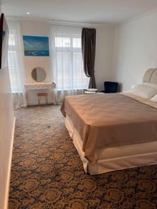 Ein Bett oder Betten in einem Zimmer der Unterkunft ART HOTEL HOUSE ONE