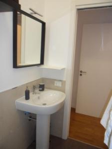 a bathroom with a white sink and a mirror at Palermo eleganza in centro città in Palermo