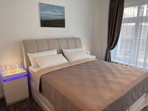 Ein Bett oder Betten in einem Zimmer der Unterkunft ART HOTEL HOUSE ONE