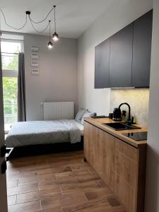 Posteľ alebo postele v izbe v ubytovaní Property Apart - plac Jana Pawla II Centrum