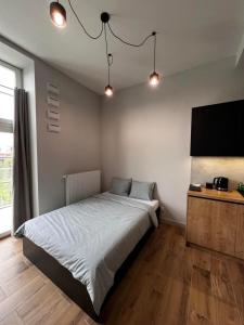 Posteľ alebo postele v izbe v ubytovaní Property Apart - plac Jana Pawla II Centrum