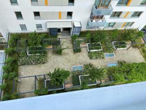 an aerial view of a building with a garden at Apartament Rzekotka Zielona Dereniowa 60 in Warsaw