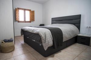 Łóżko lub łóżka w pokoju w obiekcie Casa Lumbreras