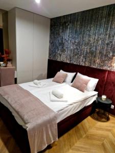 Posteľ alebo postele v izbe v ubytovaní Apartament Zamojski Rynek 21