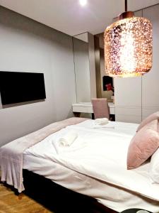 Posteľ alebo postele v izbe v ubytovaní Apartament Zamojski Rynek 21
