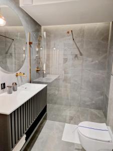 Kúpeľňa v ubytovaní Apartament Zamojski Rynek 21