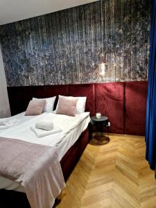 Posteľ alebo postele v izbe v ubytovaní Apartament Zamojski Rynek 21