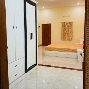 a bedroom with a bed and a sliding glass door at Sophia Homestay PP in Phnom Penh
